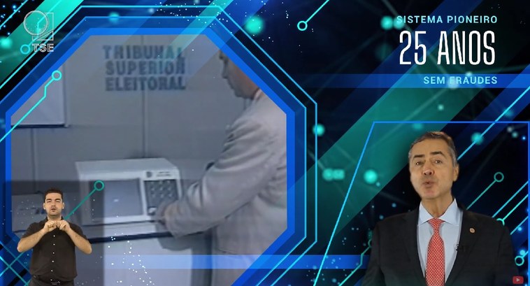 TRE-MG-campanha-Barroso Print de um vídeo, que mostra um homem apertando uma tecla de uma urna eletrônica. No canto infe...
